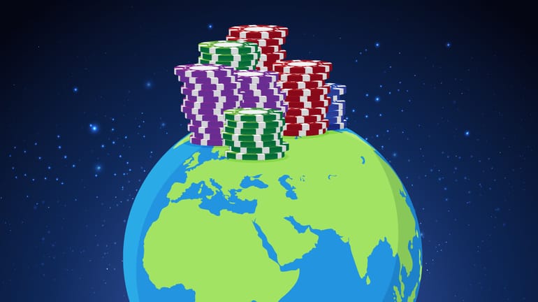 half a globe (Earth) with several stacks of chips balanced on top