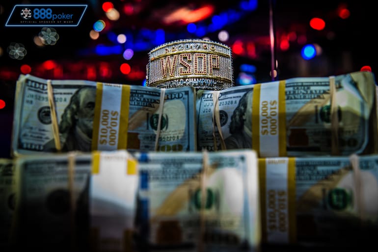 wsop bracelet on pile of cash 