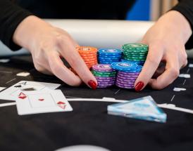 poker player going all-in with aces