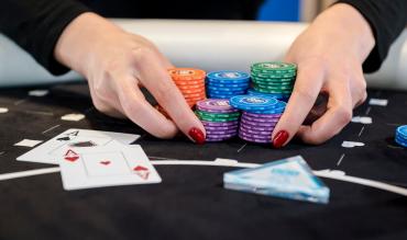 poker player going all-in with aces